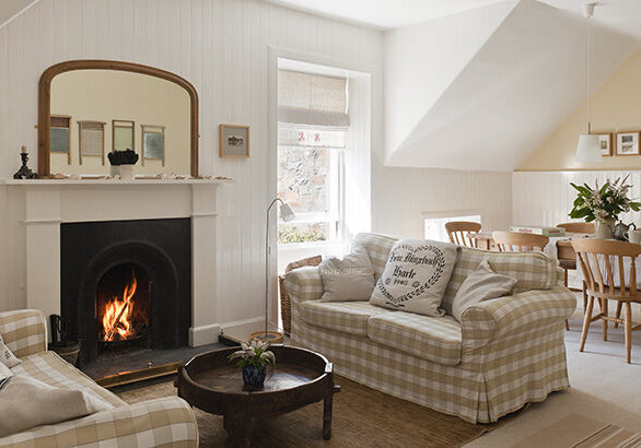 Open-plan sitting room and diner with white and beige gingam sofas (Ektorp from Ikea)