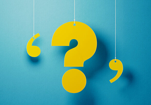 Yellow question mark with string hanging over blue background. Horizontal composition with copy space.